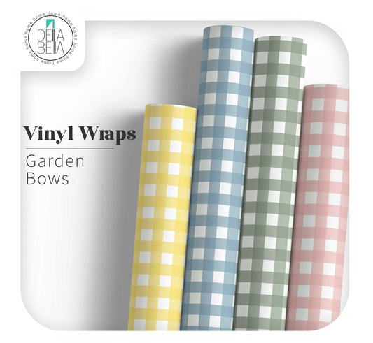 Four rolls of checkered vinyl wraps in yellow, blue, green, and pink on a white background with 'Dela Bella' branding.