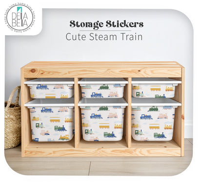 trofast Wooden storage unit with train-themed bins and 'Dela Bella' branding.