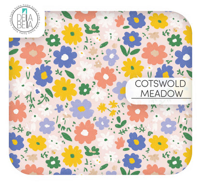 A dense ditsy floral vinyl wrap pattern for home upcycling. Features a lush 'meadow' look with tiny, delicate wildflowers in shades of peach, soft blue, and yellow on a light cream background.