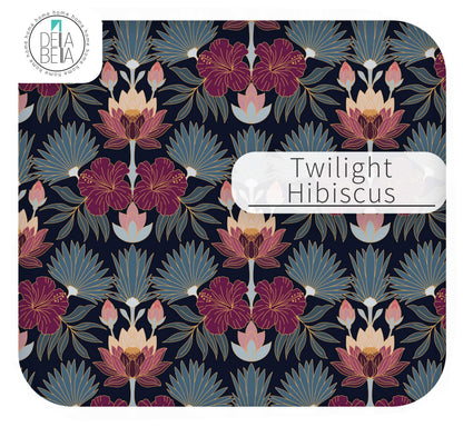 Close up of the Twilight Hibiscus IKEA Trofast sticker pattern featuring deep magenta hibiscus flowers and light blue Art Deco fan leaves on a dark navy background.