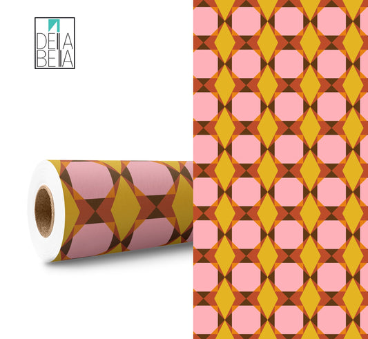 A roll of sticky back plastic with a geometric pattern, featuring shades of pink and yellow.