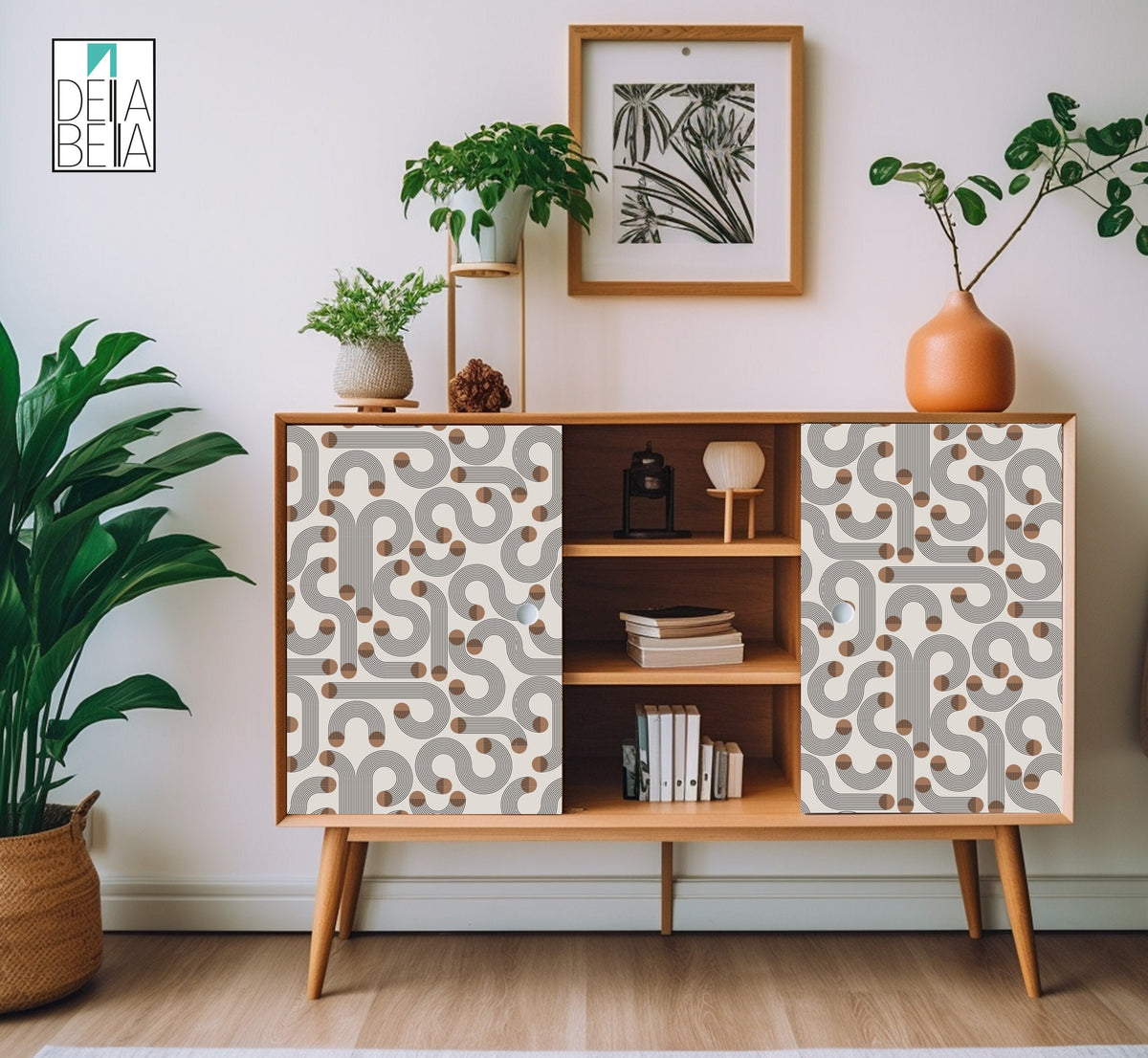 A room setting showing a sideboard with Japandi style vinyl wrapping featuring geometric patterns of arches and circles, with plants and decorative items on and around it.