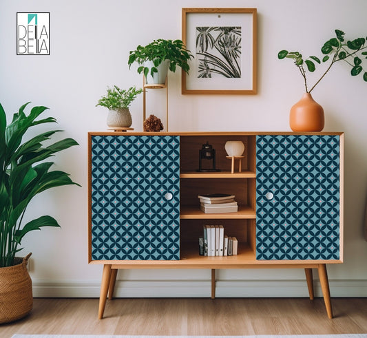 A vinyl wrap with a geometric pattern featuring blue and white colors, applied on a flat surface of a furniture piece, within a home decor setting.
