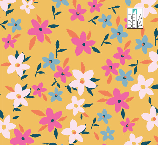 A sample of floral vinyl wrap featuring various colorful flowers on a yellow background, with a Deia Bella logo in the corner.